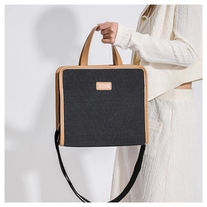 Minimalist dark gray canvas and brown leather crossbody bag for daily business commute