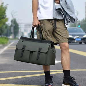 Close-up of olive green travel bag with vintage leather buckles and durable canvas