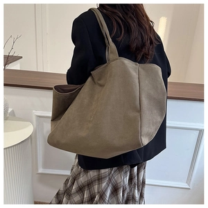 Model view of large khaki suede tote bag with leopard print accent for casual wear