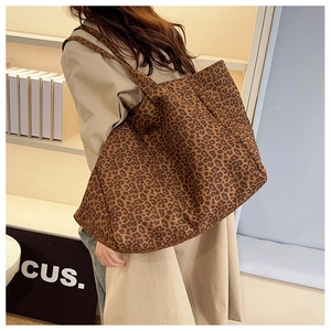 Detailed view of large leopard print canvas tote bag with spacious interior for daily commute