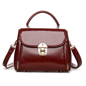 Retro deep red glossy handbag with gold lock and adjustable shoulder strap for women