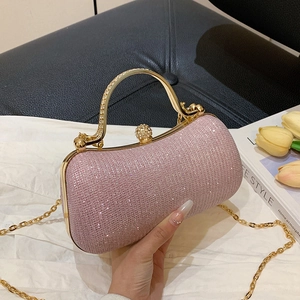 Pink rhinestone evening clutch bag with gold frame and beaded handle for formal parties
