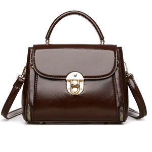 Retro coffee brown handbag with gold lock and glossy leather finish, crossbody view