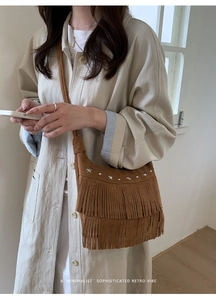 Brown suede shoulder bag featuring retro fringes and silver star studs detail