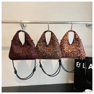 Detailed comparison of leopard print shoulder bags in three distinct brown animal patterns
