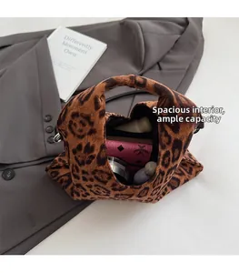 Macro view of interior storage space of the leopard plush shoulder bag for women