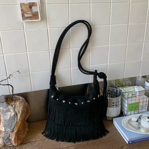 Bohemian black suede crescent shoulder bag with silver star studs and long fringe