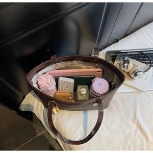 Top view showing the large capacity and interior storage of the brown tote bag