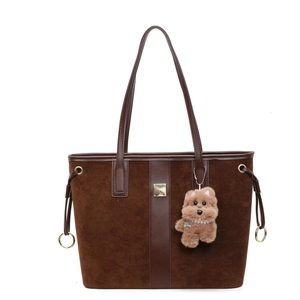 Dark brown tote bag in suede and smooth leather with cute plush bear pendant accessory