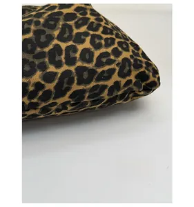 Close-up of durable leopard print canvas fabric texture with scratch-resistant surface