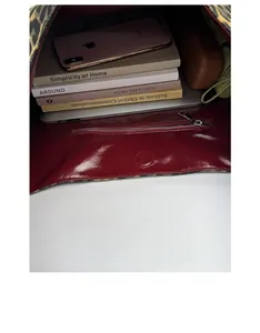 Macro view of leopard print tote bag interior showing large capacity for books and tablet