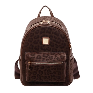 Retro leopard print backpack with velvet finish and gold hardware on white background