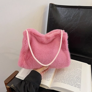 Pink faux fur shoulder bag with soft plush texture and leather strap for women