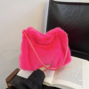 Minimalist fuchsia faux fur shoulder bag with soft plush texture for winter style