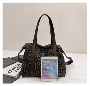 Leopard print tote bag size comparison with an iPad showing large capacity for essentials