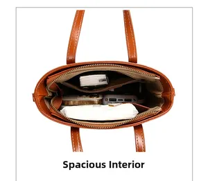Internal view of brown crocodile pattern bucket bag showing large capacity and compartments