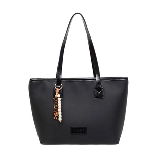 Large vintage black tote bag with wooden bead pendant and minimalist shoulder straps