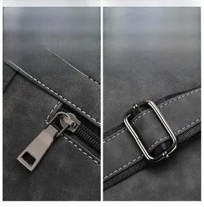 Close-up of premium gunmetal zippers and hardware on dark gray frosted fabric backpack