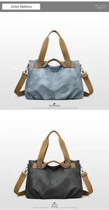 Detail view of large canvas tote bags in blue and black with brown shoulder straps