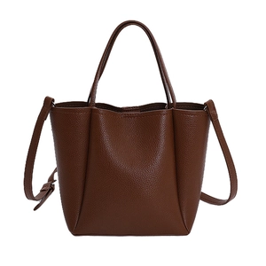 Brown pebble leather tote bag with top handles and adjustable shoulder strap for women