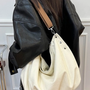 Retro canvas tote bag in beige with wide brown crossbody strap for daily commute