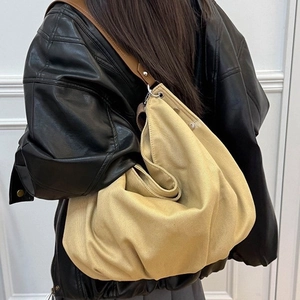 Minimalist canvas tote bag with brown leather handles and large capacity design