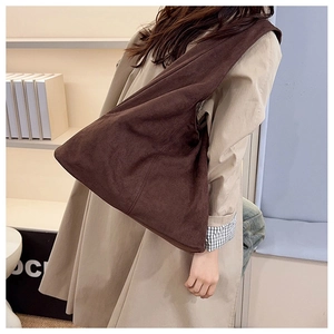 Detail of minimalist dark brown large shoulder tote bag with a matte suede texture