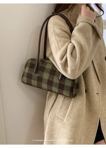 Retro checkered shoulder bag in olive and brown wool styled with a beige coat