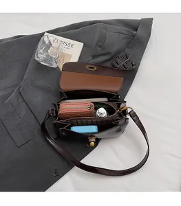 Deep brown vintage crossbody bag showing spacious multi-layer internal storage capacity