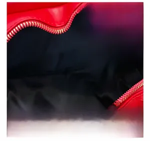 Detail view of the red heart-shaped bag showing its spacious black interior lining