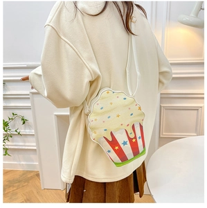 Detail of creative popcorn shaped shoulder bag with red stripes and star patterns