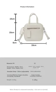Detail view of the white PU leather crossbody bag showing size 18x18x8cm and handle height