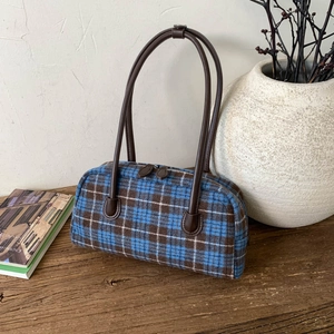 Retro plaid shell tote bag with brown leather handles and a vintage British aesthetic