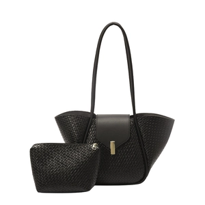 Black woven texture tote bag set with matching pouch and gold buckle on white background