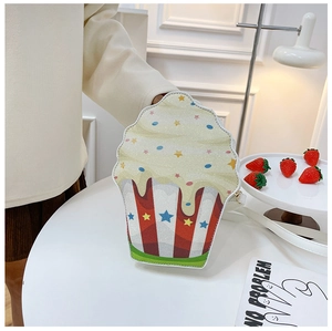 Detail of glittery cupcake shoulder bag with blue stripes and cream-like dripping edges