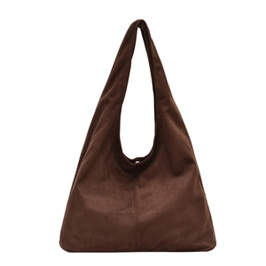 Minimalist deep brown faux suede tote bag with wide shoulder strap and vertical stitching