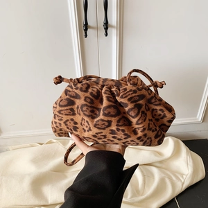 Close-up of leopard print ruched cloud bag with drawstring and thin shoulder strap