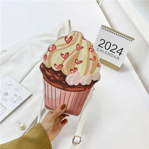 Creative cupcake shaped crossbody bag with glitter cream top and heart details