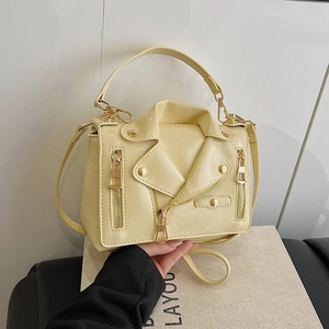 Fashionable pale yellow motorcycle jacket style handbag with rivets and shoulder strap