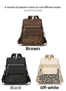 Three leopard print backpacks in brown, black, and creamy white with tassel charms