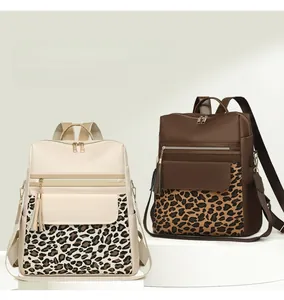 Detail of leopard print patchwork backpacks with stylish leather fringe and zipper pockets