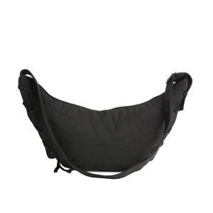Minimalist black crescent dumpling bag with decorative stitching and adjustable strap