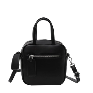Minimalist black square crossbody bag with silver zippers and adjustable shoulder strap