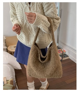 Detailed texture of fluffy brown faux mohair tote bag with soft plush fabric surface