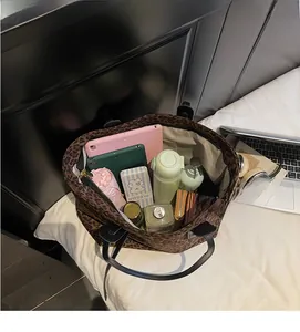 Interior view showing large capacity of the leopard print tote bag with daily essentials