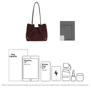 Detail showing high capacity of dark brown suede tote bag fitting an 11-inch iPad Pro