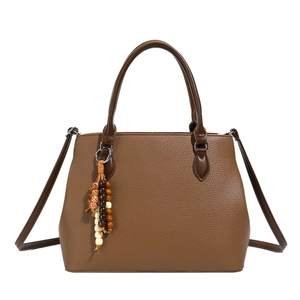 Brown lychee texture leather tote bag with wooden bead pendant and crossbody strap