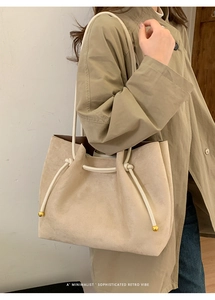 Minimalist beige suede tote bag with drawstring rope handle and gold metal detail