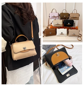 Detailed view of women's crossbody bag capacity and textured leather with metallic lock