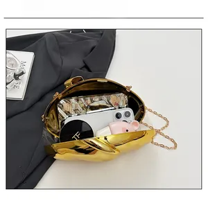 Capacity view of gold wavy mirror acrylic evening bag with phone and makeup essentials
